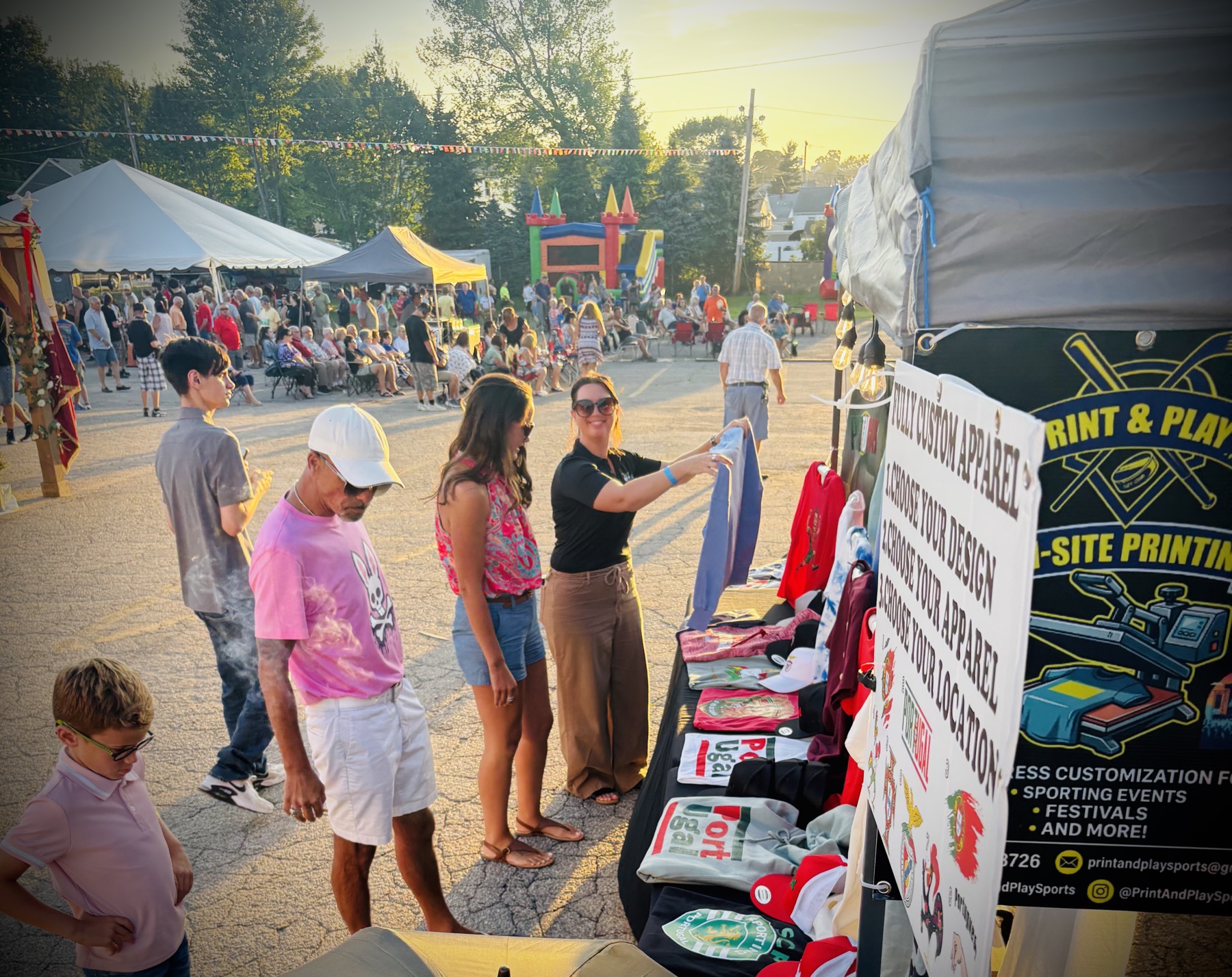 Print & Play's on-site printing booth with custom apparel process signage